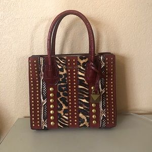 Small Michael Kors hand bag.  Excellent condition.